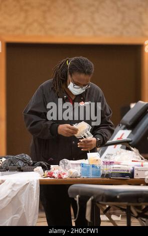 Sarina Mickle, a volunteer with American Red Cross  prepares the necessary equipment moments before the beginning of a Community Blood Drive at the NCO Club  on post Jan. 25. Stock Photo