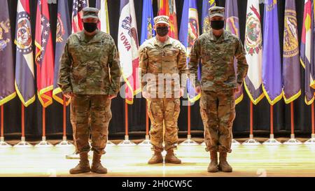Command Sgt. Maj. Raymond J. Ramirez, accepts the colors from Col ...