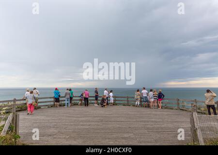 Several tourists observing the sea from the belvedere of Cap Gris-Nez, France Stock Photo