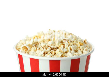 Striped paper cup with popcorn isolated on white background. Stock Photo