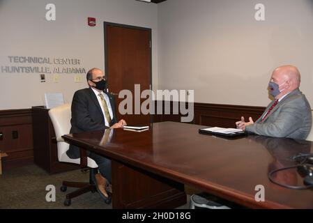 Thomas E. Webber, left, director, U.S. Army Space and Missile Defense Command Technical Center, and Kristopher “Kris” K. Graviet, division chief, Program Integration and Assurance Division, Systems Engineering Directorate, discuss the recent Tech Center reorganization and how it will benefit the command’s science and technology and engineering efforts. Stock Photo