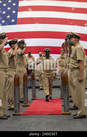 PHILIPPINE SEA (Jan. 29, 2021) Chief Hospital Corpsman Avesta El, from Aiken, S.C., a graduate of Silver Bluff High School, assigned to USS America (LHA 6), the Navy’s only forward-deployed amphibious assault ship, is promoted as a U.S. Navy chief petty officer in a ceremony in the ship’s hangar bay. The Navy is unique among the services in recognizing and celebrating promotion to E-7 as a major milestone in a Sailor’s career. America, flagship of the America Expeditionary Strike Group, along with the 31st Marine Expeditionary Unit, is operating in the U.S. 7th Fleet area of responsibility to Stock Photo