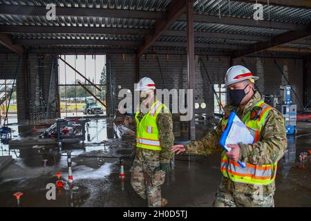 Brig. Gen. Paul Owen, left, commanding general of the U.S. Army Corps of Engineers South Pacific Division, walks through the unfinished Central Utility Plant at the site of the future VA Stockton medical complex in Stockton, California Jan. 28, 2021 as Capt. Nicholas Yager, project engineer with the USACE Sacramento District, gives him an update on the project. The CUP is a key component of the overall project as it supports the other structures on the site, including a Community Based Outpatient Clinic and a Community Living Center. The overall project is set to be completed in 2024, with the Stock Photo