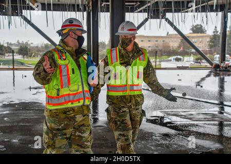 Brig. Gen. Paul Owen, right, commanding general of the U.S. Army Corps of Engineers South Pacific Division, speaks with Capt. Nicholas Yager, project manager with the USACE Sacramento District, in the unfinished Community Based Outpatient Clinic at the site of the future VA Stockton medical complex in Stockton, California Jan. 28, 2021. Contractors on the project, which recently entered its second year of construction, have been placing concrete to create the five floors of the Community Based Outpatient Clinic, the largest structure on the site. The overall project is set to be completed in 2 Stock Photo