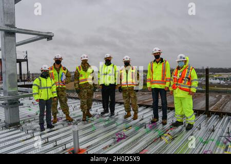 The project delivery team for the future VA Stockton medical complex, composed of representatives from the U.S. Army Corps of Engineers as well as the VA, poses for a photo on the roof of the unfinished Community Based Outpatient Clinic with Brig. Gen. Paul Owen, third from left, commanding general of the USACE South Pacific Division in Stockton, California Jan. 28, 2021. Contractors on the project, which recently entered its second year of construction, have been placing concrete to create the five floors of the Community Based Outpatient Clinic, the largest structure on the site. The overall Stock Photo