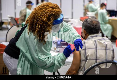 San Juan, Puerto Rico, January 29, 2021 - A Puerto Rico National Guardswoman administers the COVID-19 vaccine. The U.S. Food and Drug Administration gave an emergency use authorization to mRNA COVID-19 vaccines to stop the spread of the virus. Yuisa Rios/FEMA Stock Photo