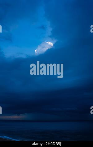 nature background abstract light cloud above dark clouds Stock Photo