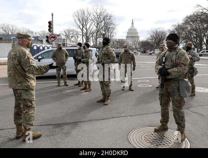 U.S. Army Maj. Gen. Ray Shields, the adjutant general of the New York National Guard, speaks with New York Army National Guard Soldiers from Headquarters and Headquarters Company, 2nd Battalion, 108th Infantry Regiment, 27th Infantry Brigade Combat Team, 42nd Infantry Division, during a command visit to the U.S. Capitol building grounds in Washington, D.C., Feb. 3, 2021.  More than 500 citizen-Soldiers from the New York Army National Guard have deployed to the nation’s capital to provide security and support to civil authorities.  The National Guard has been requested to continue supporting fe Stock Photo