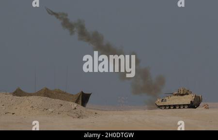 An M1150 Assault Breacher Vehicle that launches a mine clearing line ...