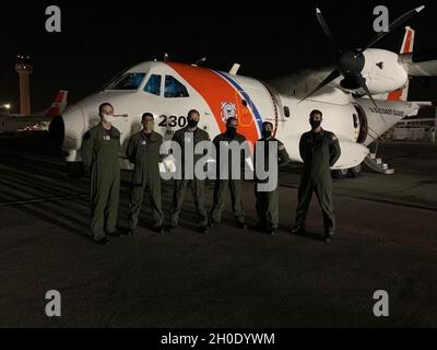 Coast Guard Air Station Miami HC-144 Ocean Sentry aircrew pose for a picture, Feb. 5, 2021, Air Station Miami, Florida. The Coast Guard medevaced a 61-year-old man from Andros Town, Bahamas. Stock Photo