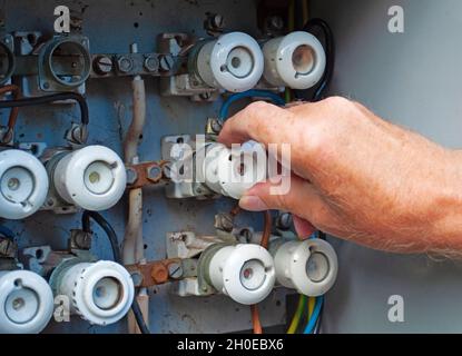 Old power distribution box with ceramic fuses Stock Photo