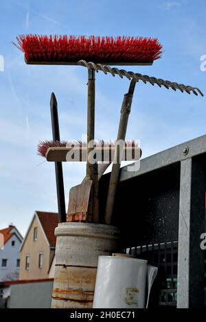 car of a gardener with tools up in the sky, besom, rake Stock Photo - Alamy