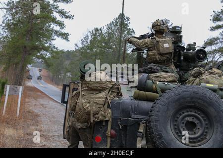 Paratroopers assigned to 5th Squadron, 73rd Cavalry Regiment, 3rd Brigade Combat Team, 82nd Airborne Division react to contact during rotation 21-04 at the Joint Readiness Training Center on Fort Polk La., Feb. 11, 2021. The rotation serves to enhance the brigade and their supporting unit's deployment readiness. Stock Photo