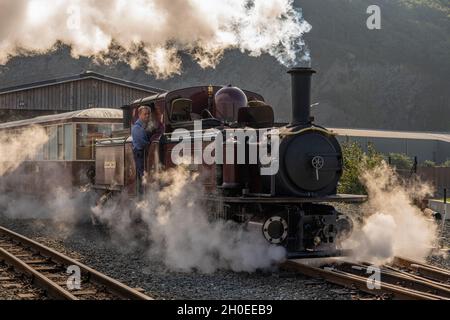 Steam train leaving the Boston Lodge Works on the Ffestiniog railway near Porthmadog Gwynedd North Wales Stock Photo