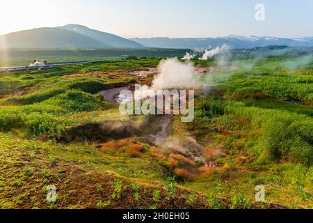 Steaming, sulfuric, active fumaroles near Pauzhetskaya Geothermal Power Plant, Kamchatka, Russia Stock Photo