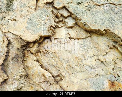 Natural yellow granite stone or rock textured background Stock Photo