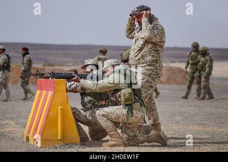 A U.S. Soldier and Jordanian military range instructor watch shell 