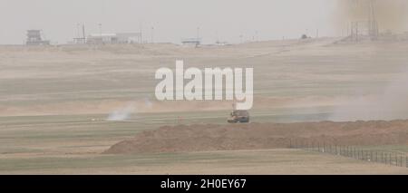 An M1150 Assault Breacher Vehicle that launches a mine clearing line ...