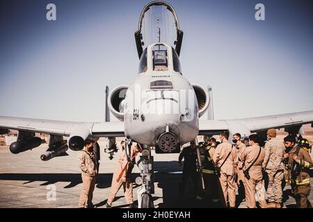 U.S. Marines from various units on Marine Corps Air Ground Combat Center are shown a Fairchild Republic A-10C Thunderbolt II aircraft on MCAGCC, Twentynine Palms, California, February 18, 2021. The purpose of the exercise was to teach Marines about the aircraft and to demonstrate the refueling process. Stock Photo