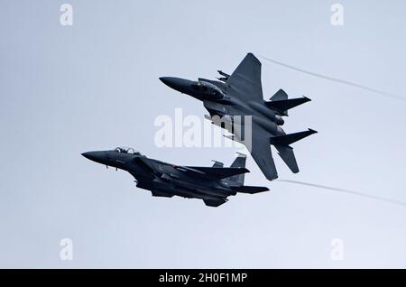 F-15E Strike Eagles assigned to the 492nd Fighter Squadron return from a training sortie at Royal Air Force Lakenheath, England, Feb. 19, 2021. Through daily training, the Liberty Wing ensures Airmen and aircrews are postured to provide lethal combat power across the spectrum of military operations. Stock Photo