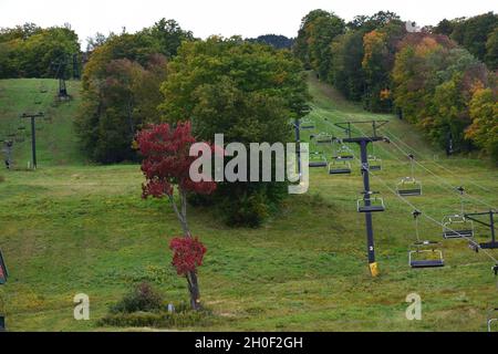 Autumn foliage at Mount Snow, Vermont, featuring colorful forests and scenic mountain landscapes during peak fall season in New England. Stock Photo