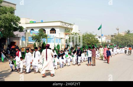 Hyderabad, Pakistan, October 12, 2021. Teachers and students of Islamic Seminary are holding Jashan-e-Eid Milad-un-Nabi (SAW) rally in connection of 12th Rabi-ul-Awwal the Birthday Ceremony of Holy Prophet (P.B.U.H) coming ahead, at Korangi Sector-48 area in Karachi on Tuesday, October 12, 2021.