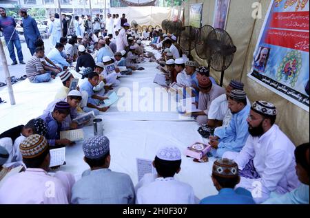 Hyderabad, Pakistan, October 12, 2021. Leaders and activists of Bengali Action Committee reciting Holy Quran and Fateha for the soul of Nuclear Scientist, Dr. Abdul Qadeer Khan who passed away in Islamabad, during condolence ceremony held at Karachi on Tuesday, October 12, 2021.