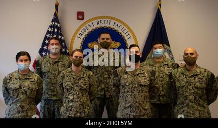 SILVERDALE, Wash. (Feb. 23, 2021) – Trident Refit Facility Bangor (TRFB) Career Counselors (from left to right) Gas Turbine Systems Technician (Mechanical) 2nd Class Keslie Gonzalez, Yeoman (Submarines) 2nd Class Ethan Noe, Gas Turbine Systems Technician (Mechanical) 2nd Class Thomas D’Antonio, Machinist Mate (Auxiliary) 2nd Class Matthew Bingham, Sonar Technician (Submarines) 2nd Class Christopher Mcanally, Command Career Counselor (CCC) Machinist Mate (Auxiliary) 2nd Class Leo Zhang, and Hull Maintenance Technician 1st Class Audon Ariasmartinez represent TRFB’s Command Career Management Prog Stock Photo