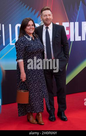 LONDON, ENGLAND - OCTOBER 12: Lindsay Brunnock and Kenneth Branagh attend the ‘Belfast’ European Premiere during the 65th BFI London Film Festival at The Royal Festival Hall on October 12, 2021 in London, England. Photo by Gary Mitchell Stock Photo