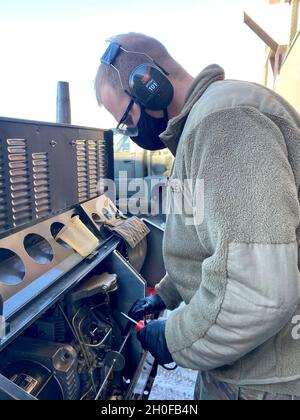 An Aerospace Ground Equipment (AGE) specialist from the 148th Fighter Wing, Minnesota Air National Guard, performs maintenance on a piece of equipment. Responsible for maintaining and repairing the equipment that supplies electricity, hydraulic pressure and air pressure to our F-16s, Aerospace Ground Equipment specialists play an essential role ensuring aircraft are ready for flight. Stock Photo