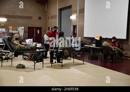 Service members with the Montana National Guard take time out of their day to donate blood at an American Red Cross Blood Drive at Fort Harrison, Montana, February 25, 2021. Stock Photo