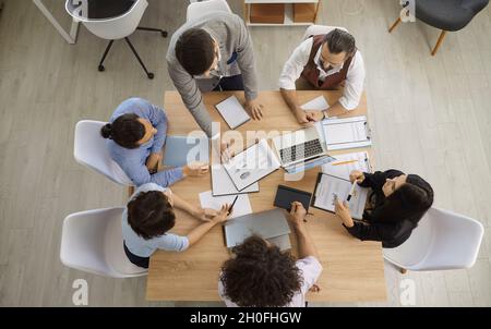 Group of women and man working together. Stock Photo
