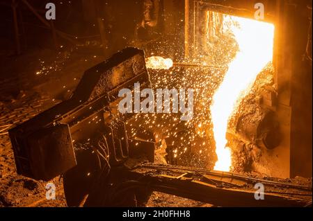 process of taking a sample of liquid metal in a steelmaking furnace Stock Photo