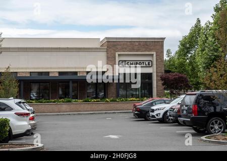 Kirkland, WA USA - circa July 2021: Street view of a Chipotle Mexican fast casual food establishment. Stock Photo