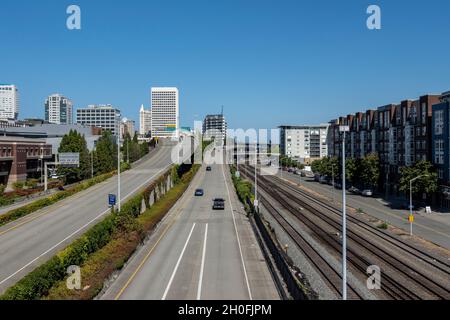 Tacoma, WA USA - circa August 2021: Aerial view of downtown Tacoma's highway traffic on a bright, sunny day Stock Photo