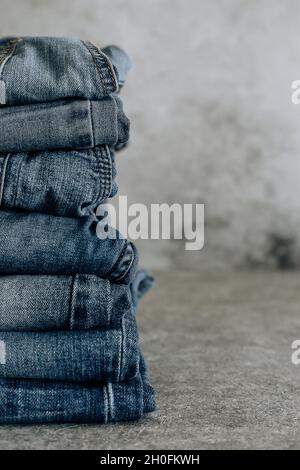 Lot of different blue jeans Blue Jeans, stack of jeans. Stock Photo