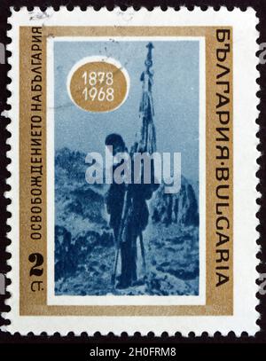 BULGARIA - CIRCA 1968: a stamp printed in Bulgaria shows Flag of Samara, Painting by J. Veschin, 90th Anniversary of the Liberation from Turkey, circa Stock Photo