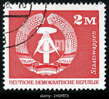 GERMANY - CIRCA 1973: a stamp printed in Germany shows Coat of Arms of DDR, circa 1973 Stock Photo