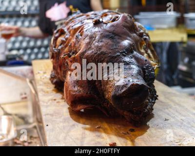 Closeup shot of a delicious barbecued pig roast placed on a table; Indonesian dish Stock Photo