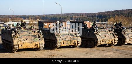 U.S. Army Soldiers assigned to the 1st Battalion, 4th Infantry Regiment, conduct the OPFOR (opposing forces) mission while riding in the M113 armored personnel carrier, at Hohenfels Training Area, Germany, Feb. 28, 2021, during Combined Resolve XV. The exercise is a Headquarters Department of the Army directed Multinational exercise designed to build 1st Armored Brigade Combat Team, 1st Cavalry Division’s readiness and enhance interoperability with allied forces to fight and win against any adversary. Stock Photo