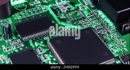 electronic circuit board with passive and active circuit components and IC close-up Stock Photo