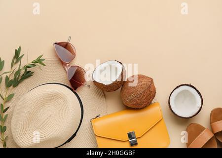 Composition with female accessories and coconuts on color background Stock Photo