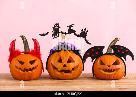 Carved Halloween Pumpkins On Pink Background, Top View Stock Photo - Alamy