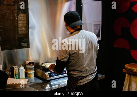Chef is working in the restaurant kitchen. Stock Photo