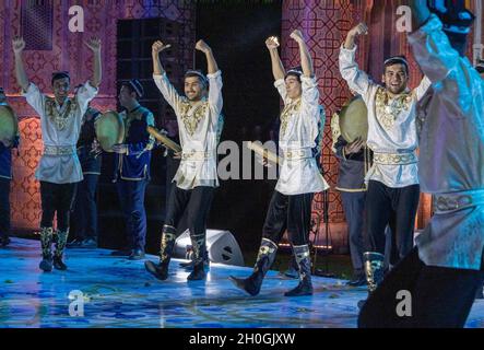 make dancers performing traditional dances for delegates of international conference at a gala dinner, Tashkent, Uzbekistan Stock Photo
