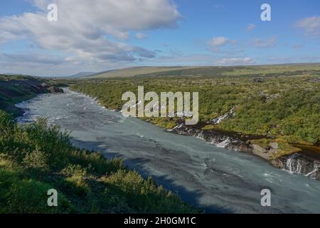 Borgarfjordur Region, Iceland: The Hraunfossar waterfalls, formed by rivulets streaming out of the Hallmundarhraun, a lava field formed by an eruption Stock Photo