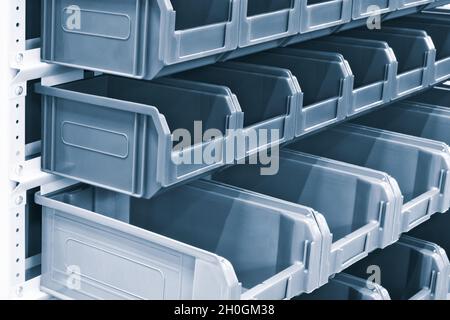 rows of multicolored plastic boxes for components Stock Photo