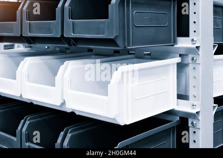 rows of multicolored plastic boxes for components Stock Photo