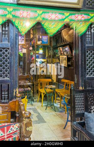 Cairo, Egypt- September 25 2021: Interior of old famous coffeehouse, El Fishawi, located in historic Mamluk era Khan al-Khalili famous bazaar and souq
