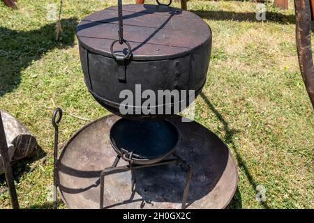 Cooking equipment replicas used by medieval vikings displayed by a re-enactment troupe at a village fair Stock Photo